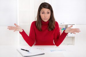 Woman at a desk with a notepad